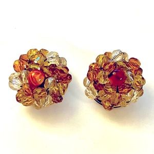 Vintage clip on bead earrings. shades of amber color. very good condition.